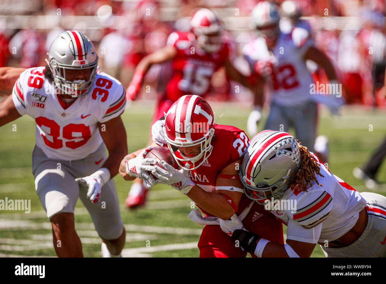 Bloomington, United States. 14th Sep, 2019. Indiana University's Cole Gest (22) carries the ball against Ohio State's Chase Young (2) during an NCAA football game at IU's Memorial Stadium.(Finale score: Ohio state 50 - 10 Indiana University ) Credit: SOPA Images Limited/Alamy Live News Stock Photo