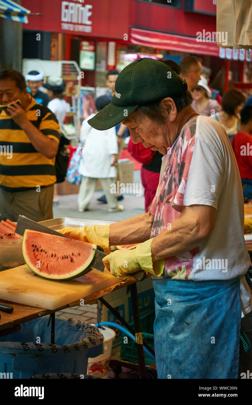 ISTANBUL,TURKEY-JUNE 7:Guys slicing watermelon to sell at their