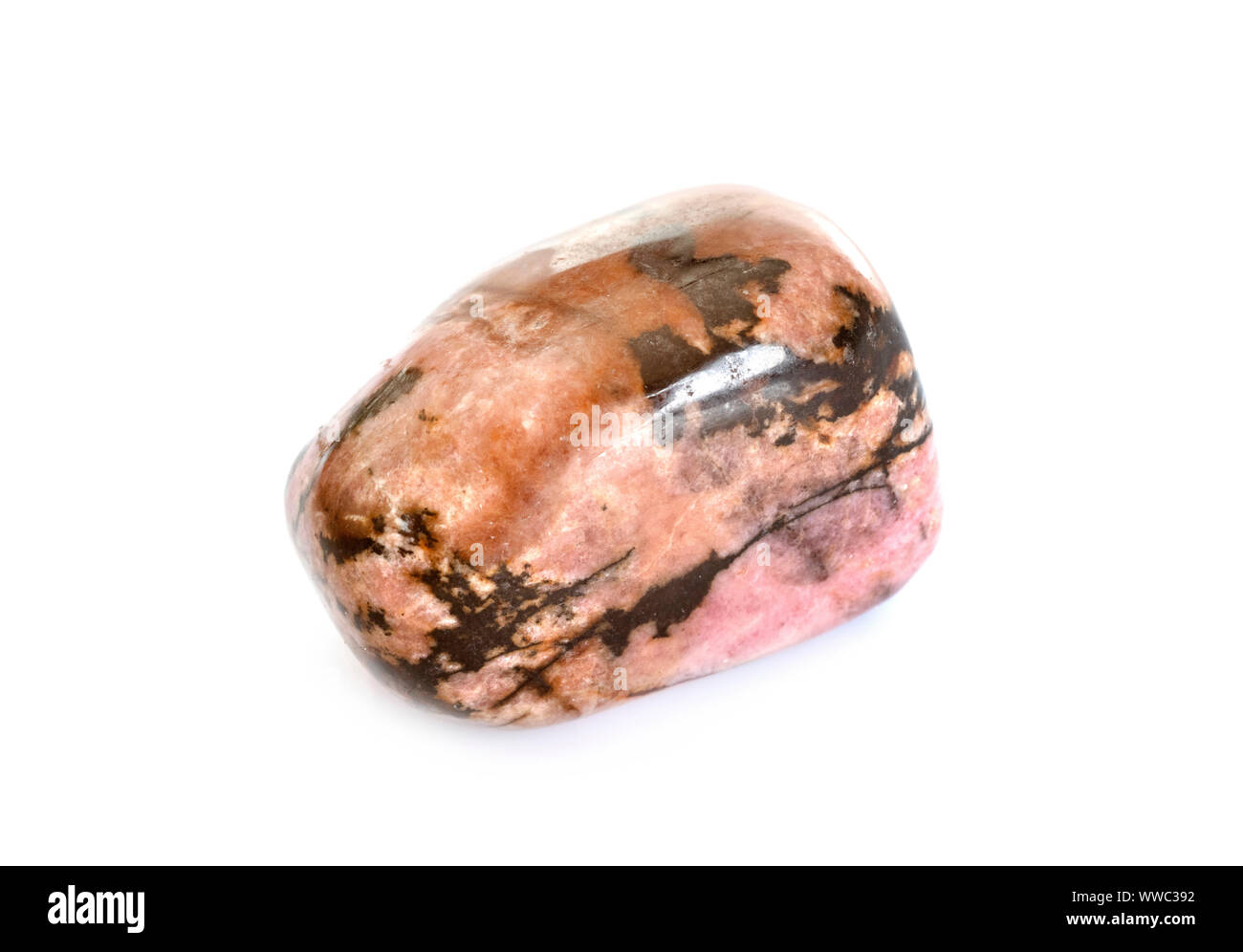 polished rhodonite in front of white background Stock Photo - Alamy