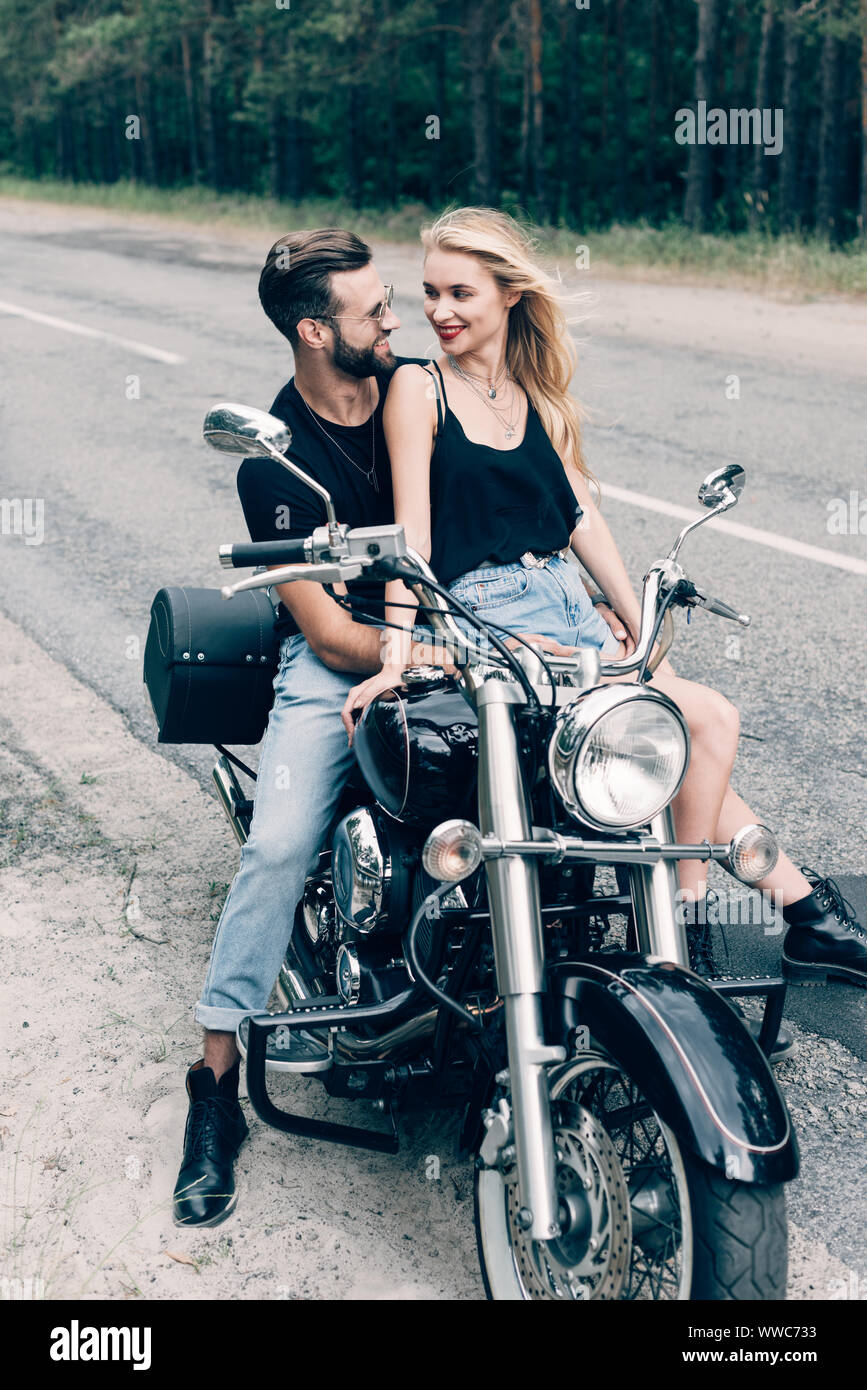 Young man and woman poses with retro bikes. Couple on vintage bicycles. Old  cycles, romantic date Stock Photo - Alamy
