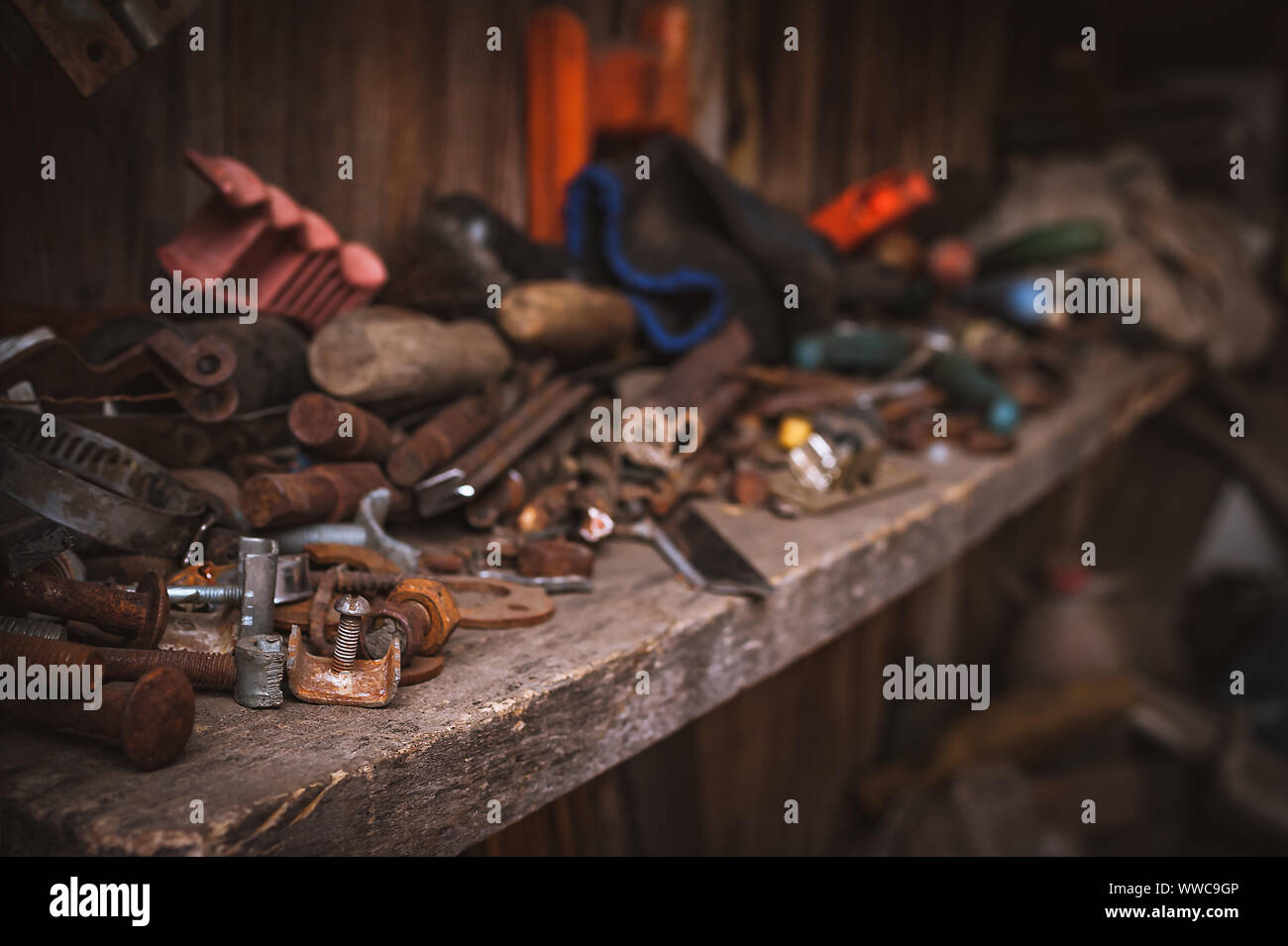 Perspective View of a Messy Wooden Shelf in a Garage Workshop. Keeping Your Workspace Clean and Tidy Concept. Stock Photo