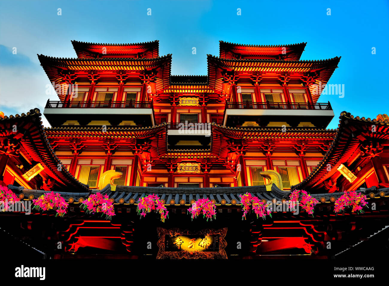 Exterior of Buddha Tooth Relic Temple in Chinatown, Singapore at evening blue hour and lit for Chinese New Year Stock Photo