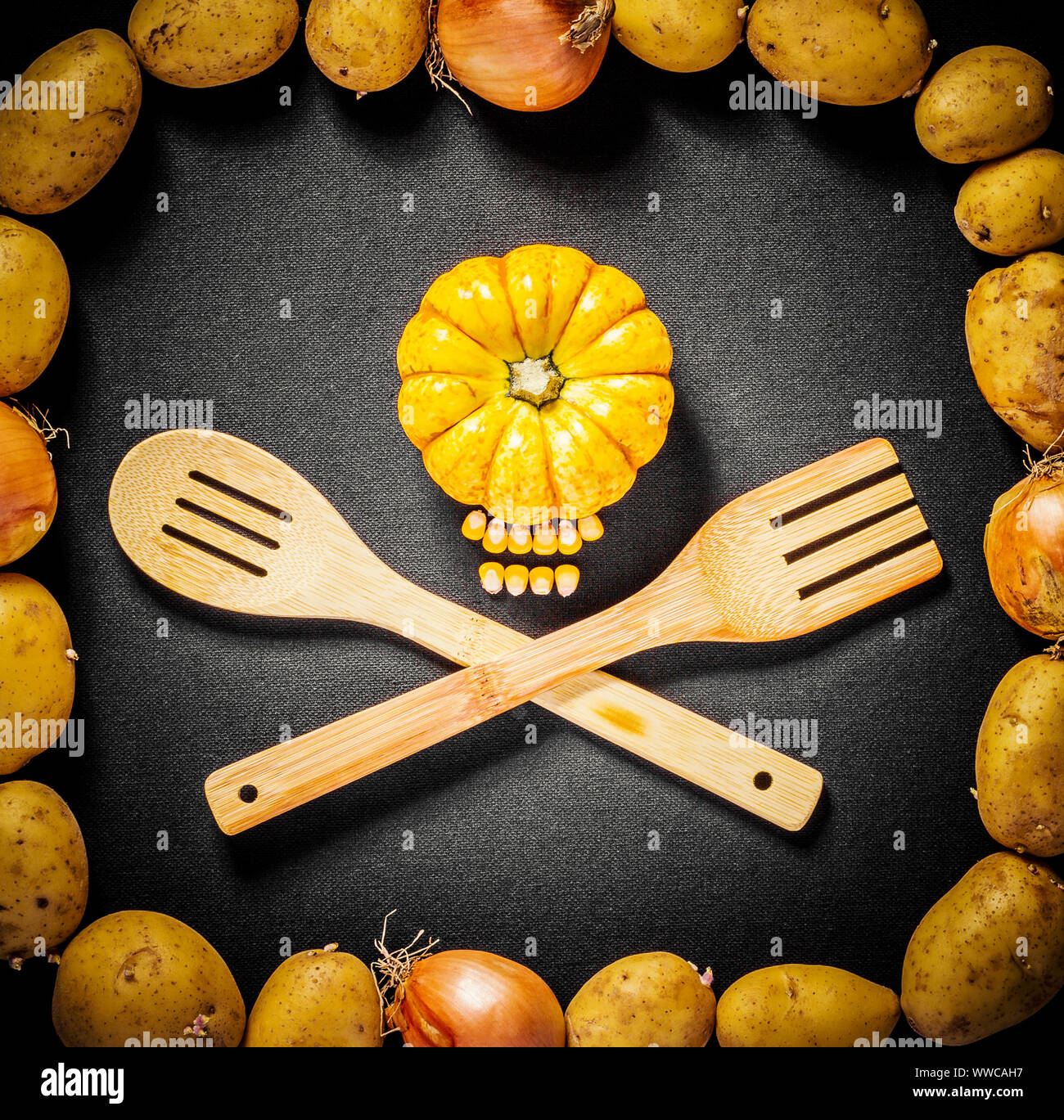 Pumpkin head with bamboo spoon and fork, top view Stock Photo