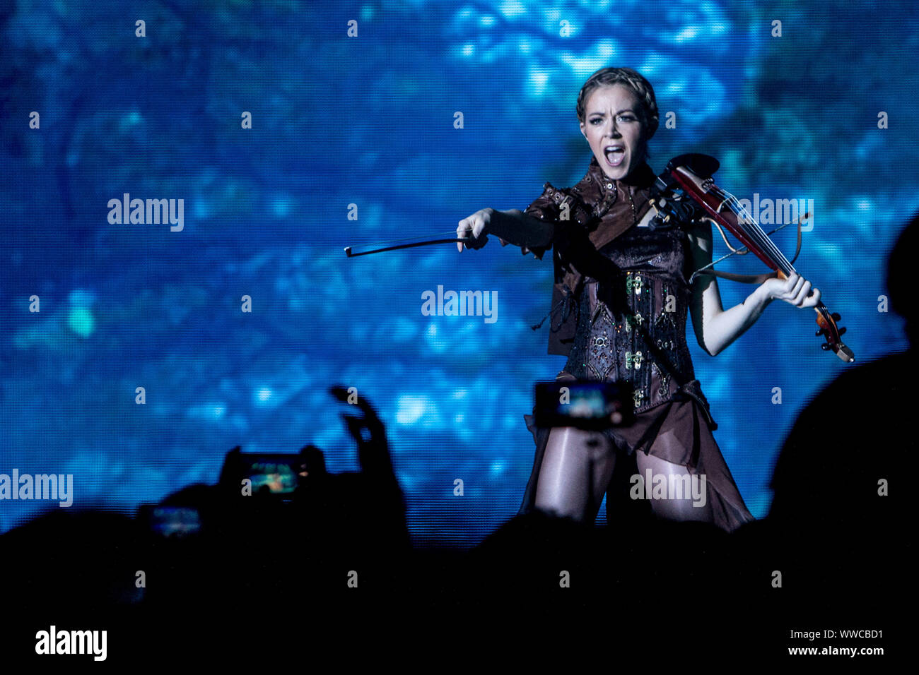 American violinist, singer and songwriter Lindsey Stirling performs live at Alcatraz in Milano, Italy, on September 14 2019. Lindsey Stirling has been named in Forbes magazine's 30 Under 30 In Music: The Class Of 2015. Forbes notes her quarter-finalist position on America's Got Talent season five in 2010, a No. 2 position on the Billboard 200 for her second album Shatter Me in 2014, and her 11 million subscribers on YouTube. Stock Photo