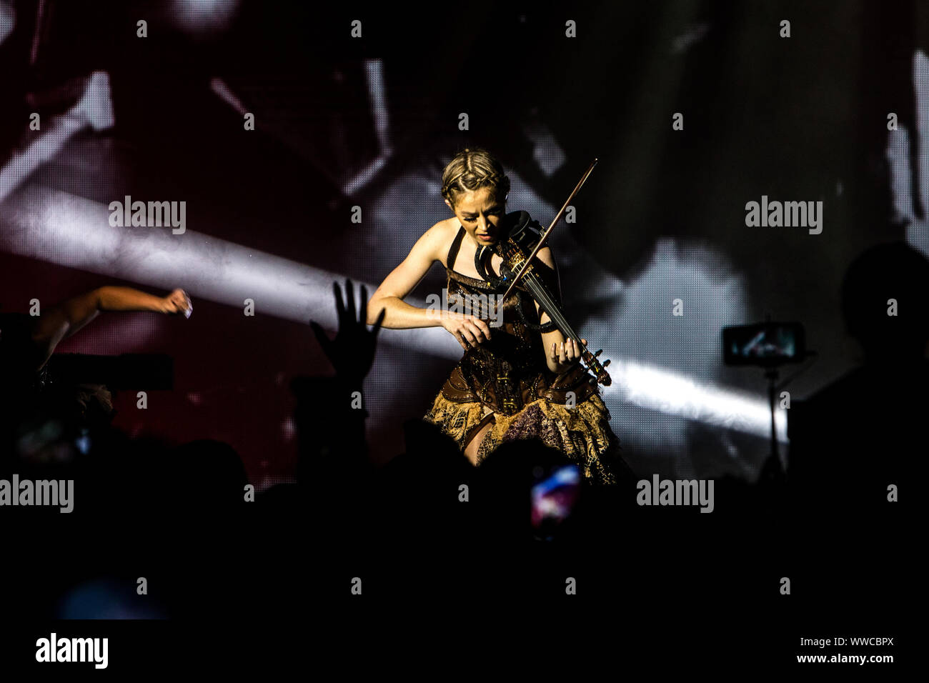 American violinist, singer and songwriter Lindsey Stirling performs live at Alcatraz in Milano, Italy, on September 14 2019. Lindsey Stirling has been named in Forbes magazine's 30 Under 30 In Music: The Class Of 2015. Forbes notes her quarter-finalist position on America's Got Talent season five in 2010, a No. 2 position on the Billboard 200 for her second album Shatter Me in 2014, and her 11 million subscribers on YouTube. Stock Photo