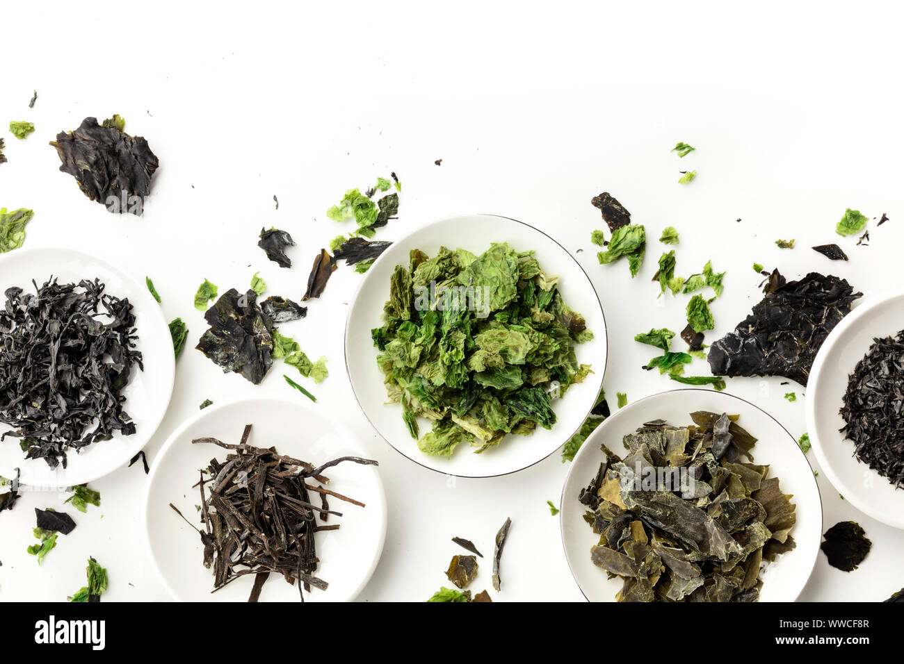 Various dry seaweed, sea vegetables, shot from the top on white. Superfoods background with a place for text Stock Photo