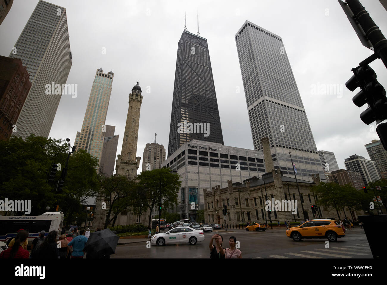 looking down north michigan avenue magnificent mile on a wet overcast day in Chicago Illinois USA Stock Photo