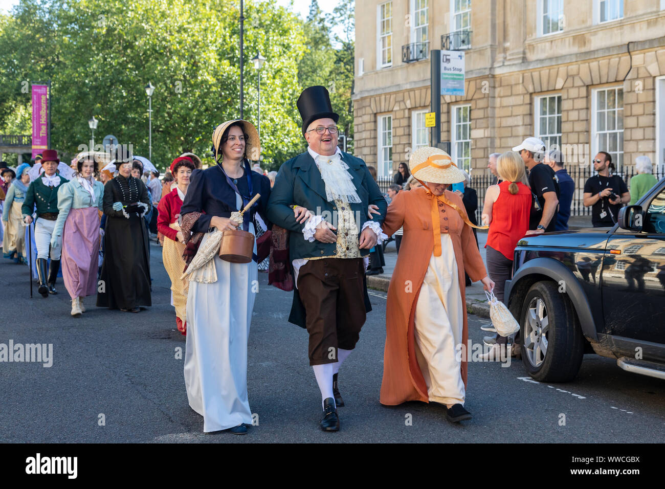 Jane Austen Festival 2019.  The Grand Regency Costumed Promenade where 500+ people from around the world join the official opening procession of the Jane Austen festival dressed in period costume. Bath, England, UK Stock Photo