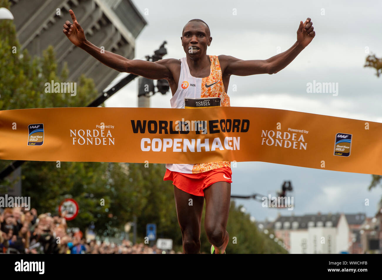 Geoffrey Kamworor smashes the Half Marathon World Record as he crosses the finishing line during the 2019 Copenhagen Half Marathon in Denmark. Stock Photo