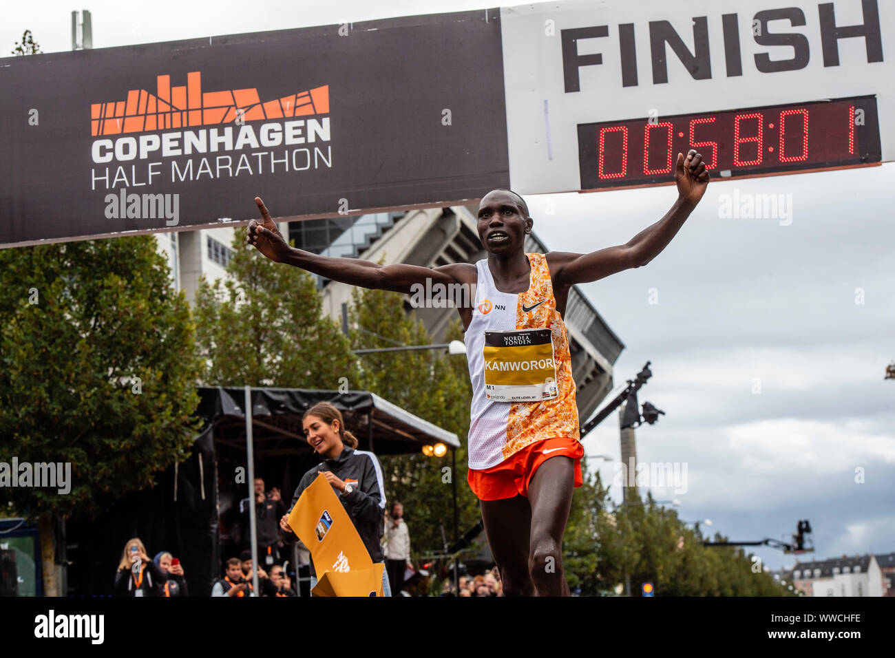 Geoffrey Kamworor smashes the Half Marathon World Record as he crosses the finishing line during the 2019 Copenhagen Half Marathon in Denmark. Stock Photo