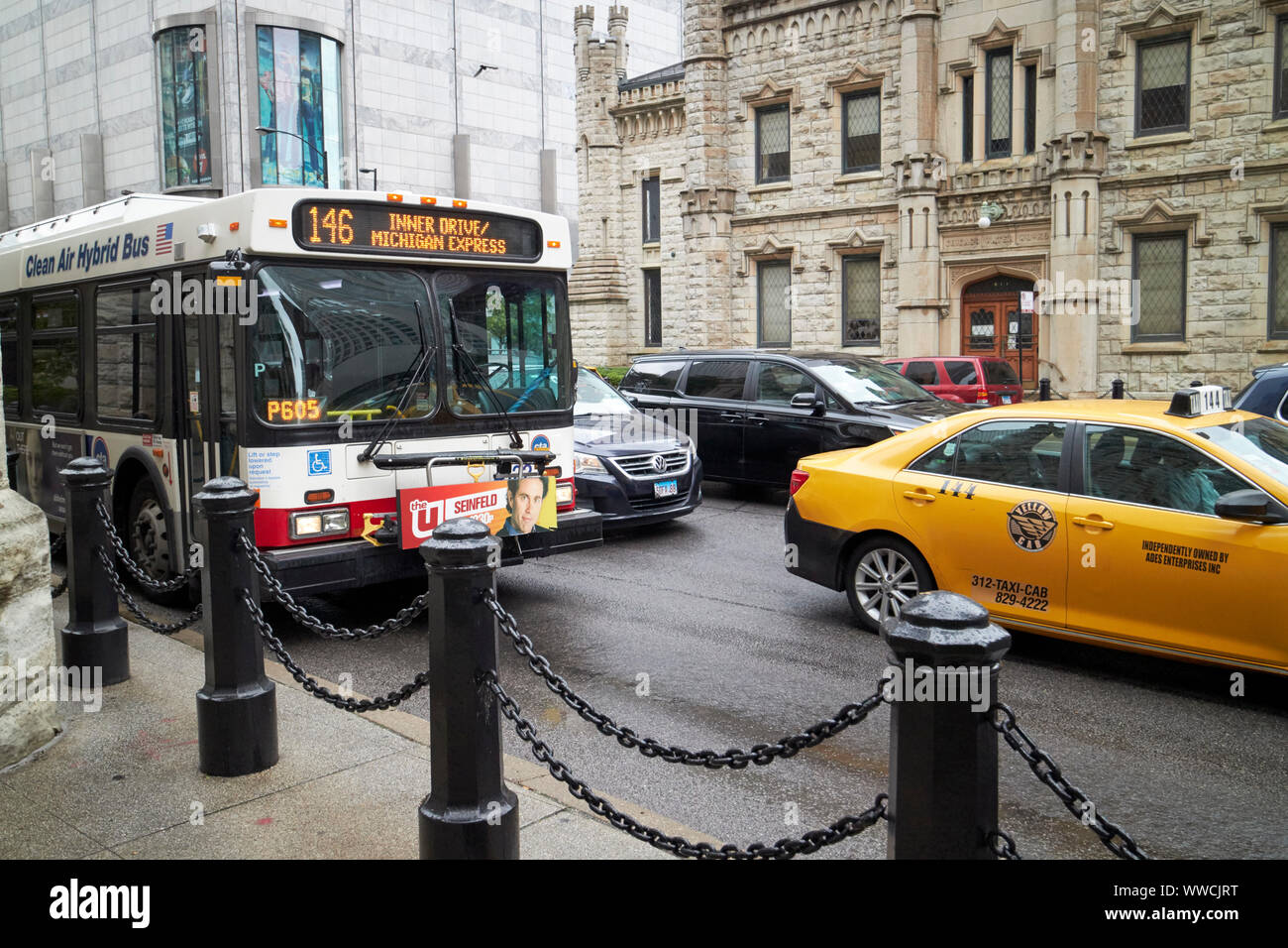 bus and yellow cab stuck in traffic on north michigan avenue Chicago Illinois USA Stock Photo