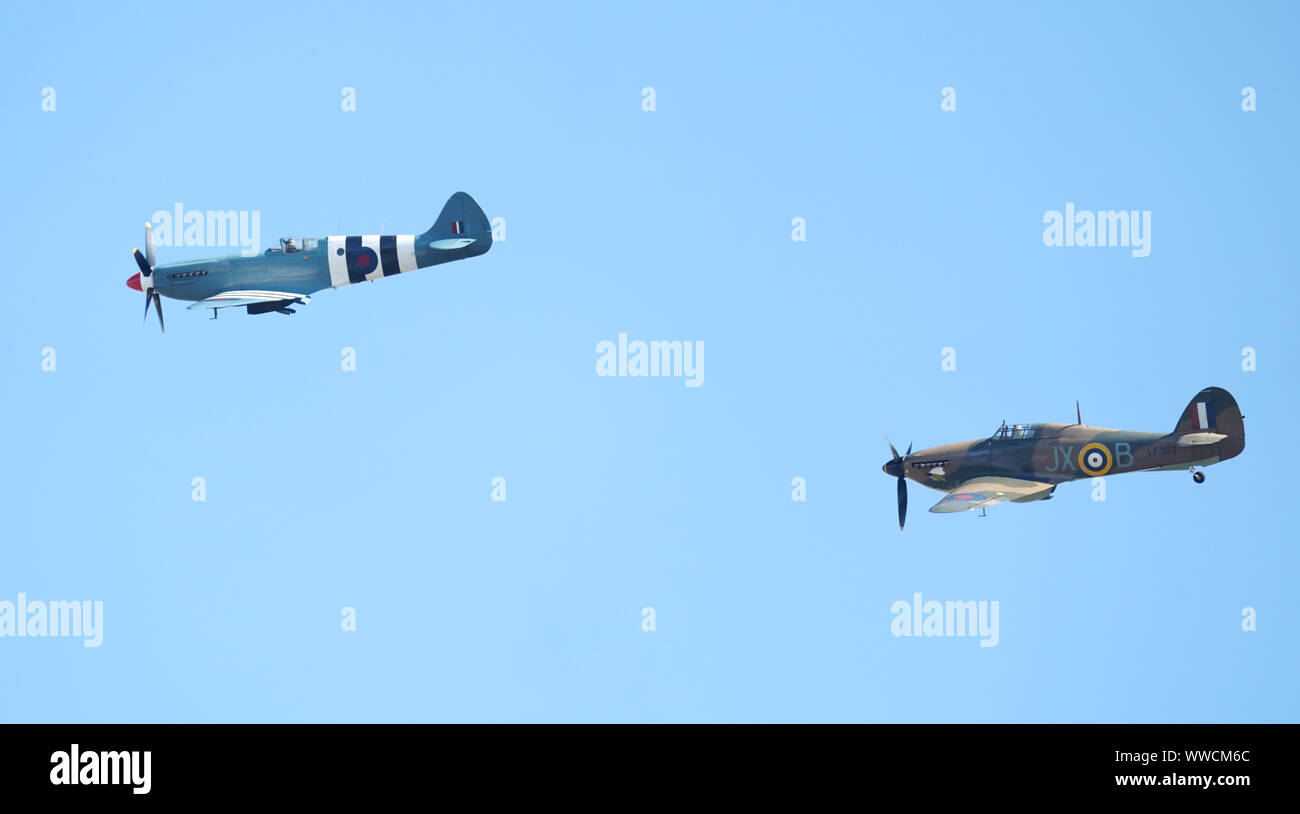 A Hurricane and Spitfire fly over the action during day four of the fifth test match at The Kia Oval, London. Stock Photo