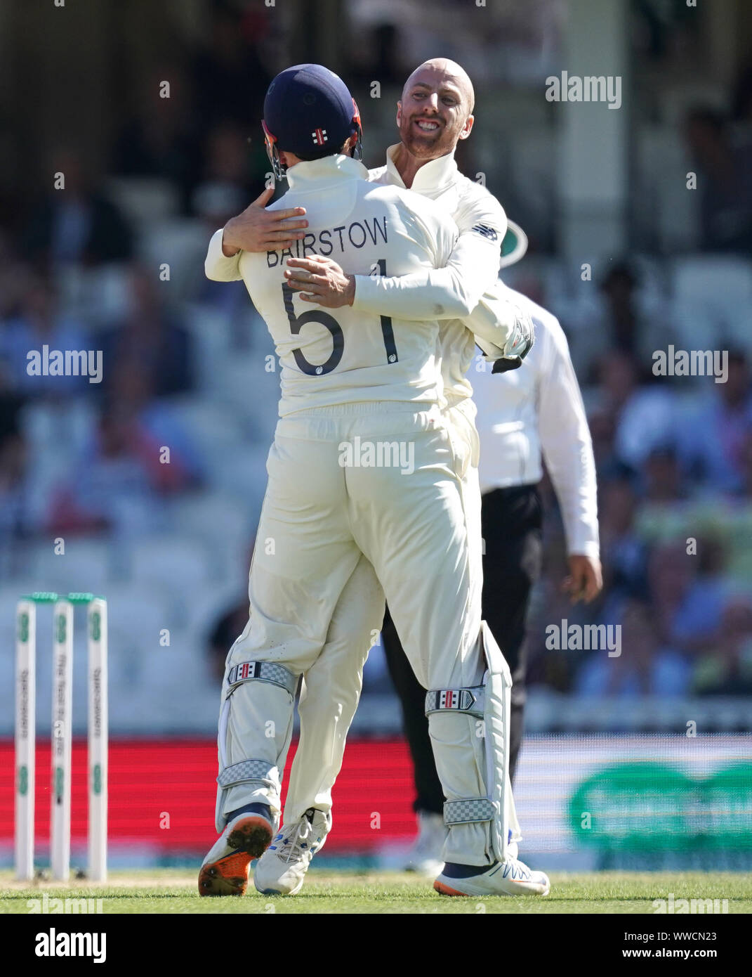 England's Jack Leach (right) celebrates after Jonny Bairstow stumps out Australia's Marnus Labuschagne during day four of the fifth test match at The Kia Oval, London. Stock Photo