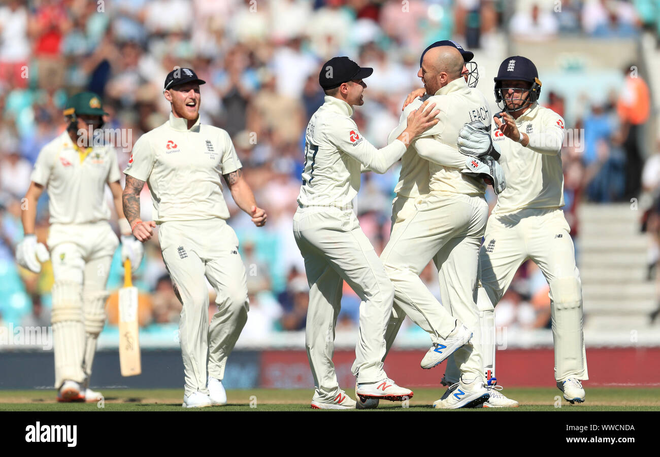 England's Jack Leach (second right) celebrates with team-mates after dismissing Australia's Marnus Labuschagne during day four of the fifth test match at The Kia Oval, London. Stock Photo