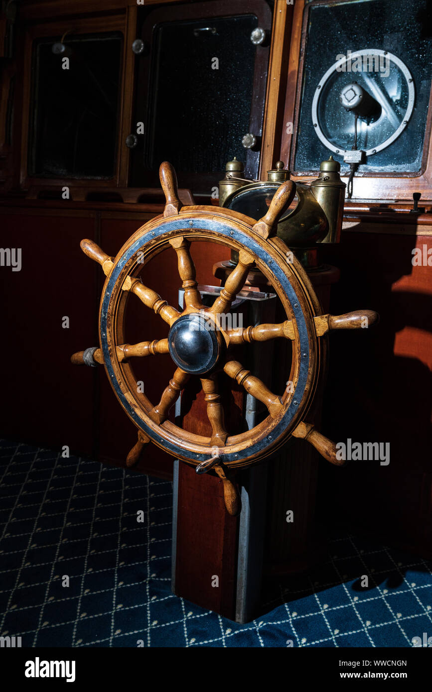 Old boat, steering wheel from brass and wood. Ship rudder. Sailboat