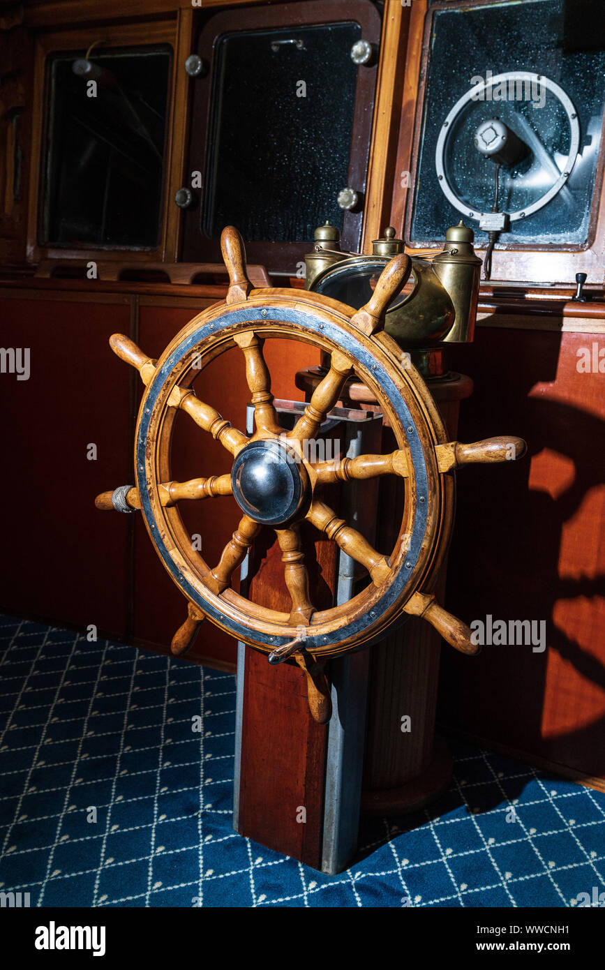 Old boat, steering wheel from brass and wood. Ship rudder. Sailboat