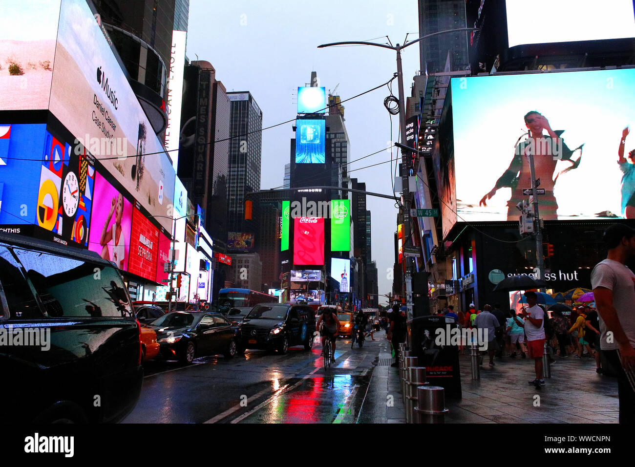 Times Square Congested Traffic of pedestrians, cyclists, and cars trudges through Times Square ...