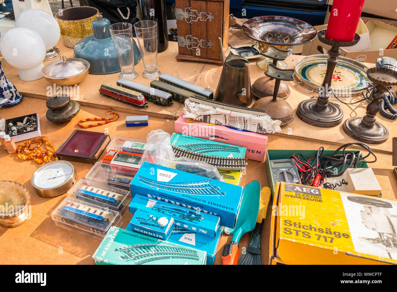 Freilassing, Germany - September 15, 2018: Various old things for sale on an outdoors flea market. Details for model miniature railway for sale. Stock Photo