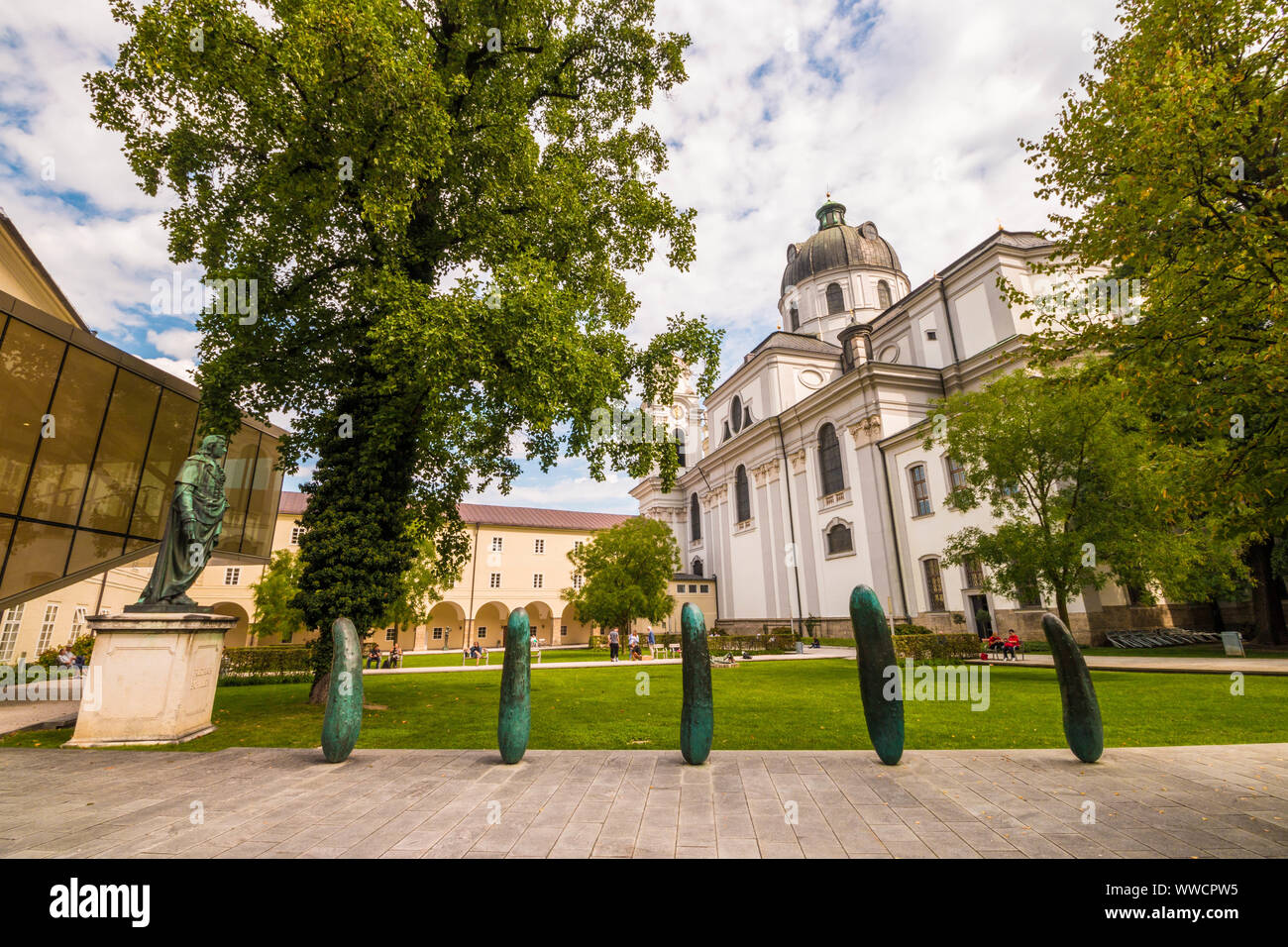 Salzburg, Austria - September 13, 2018: Small park Furtwaenglerpark with green lawn near University of Salzburg and  baroque Kollegienkirche Stock Photo
