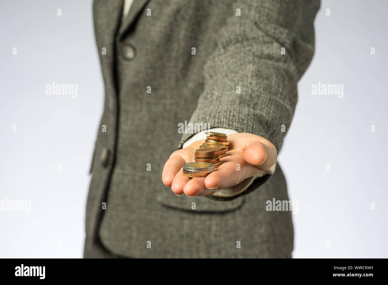 Business woman holding money in hand. European finance currency, coins Stock Photo - Alamy