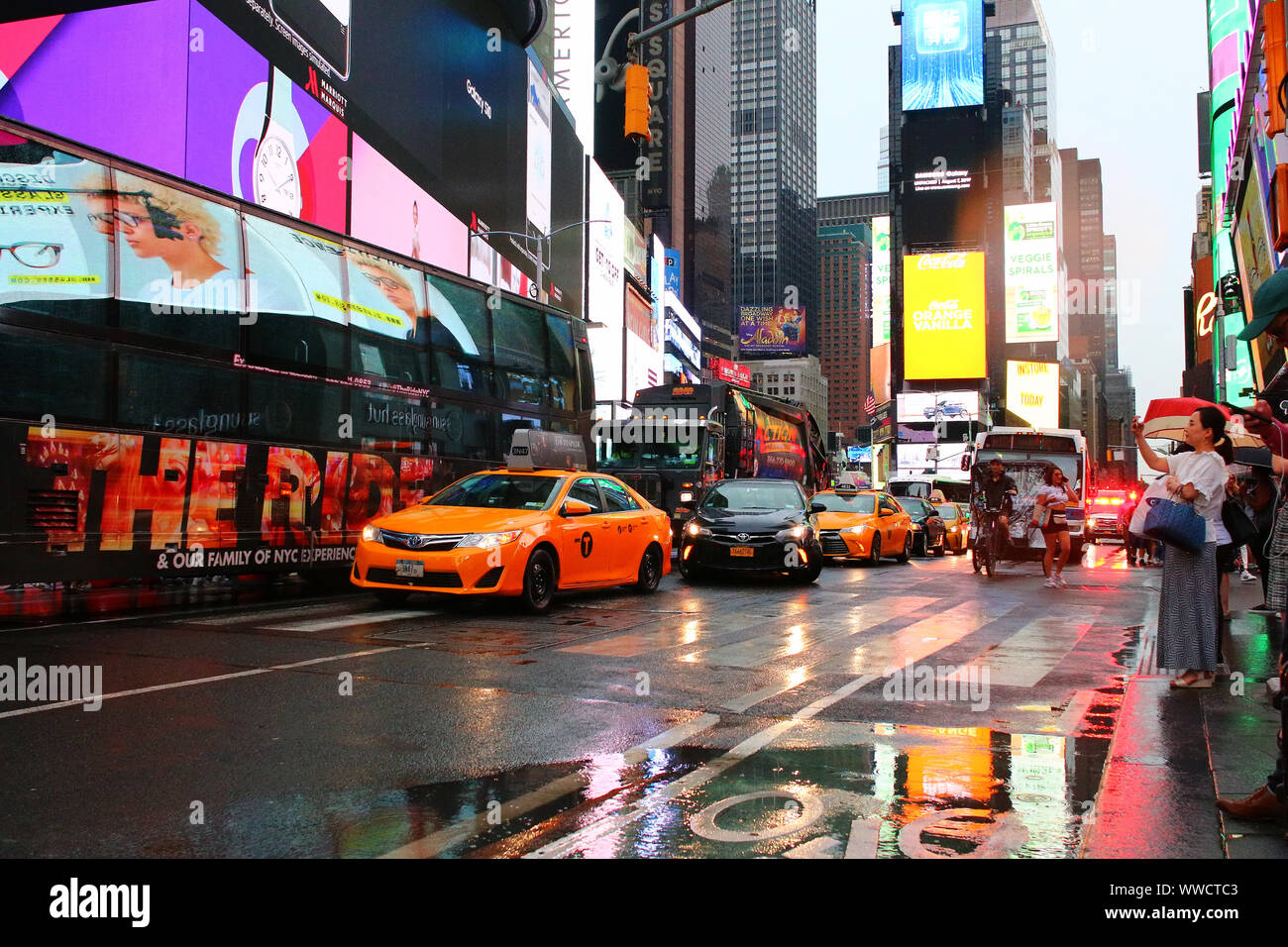 Times Square Congested Traffic of pedestrians, cyclists, and cars trudges through Times Square ...