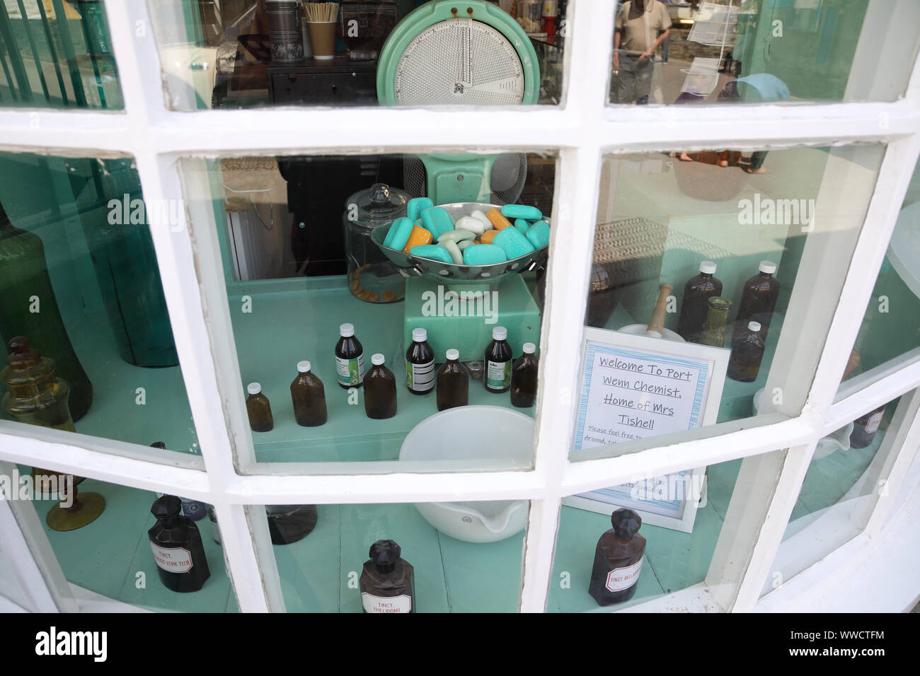 Shop window at Port Isaac used as Mrs Tishell's chemist window ay Port Wenn in the Tv series Doc Martin Stock Photo