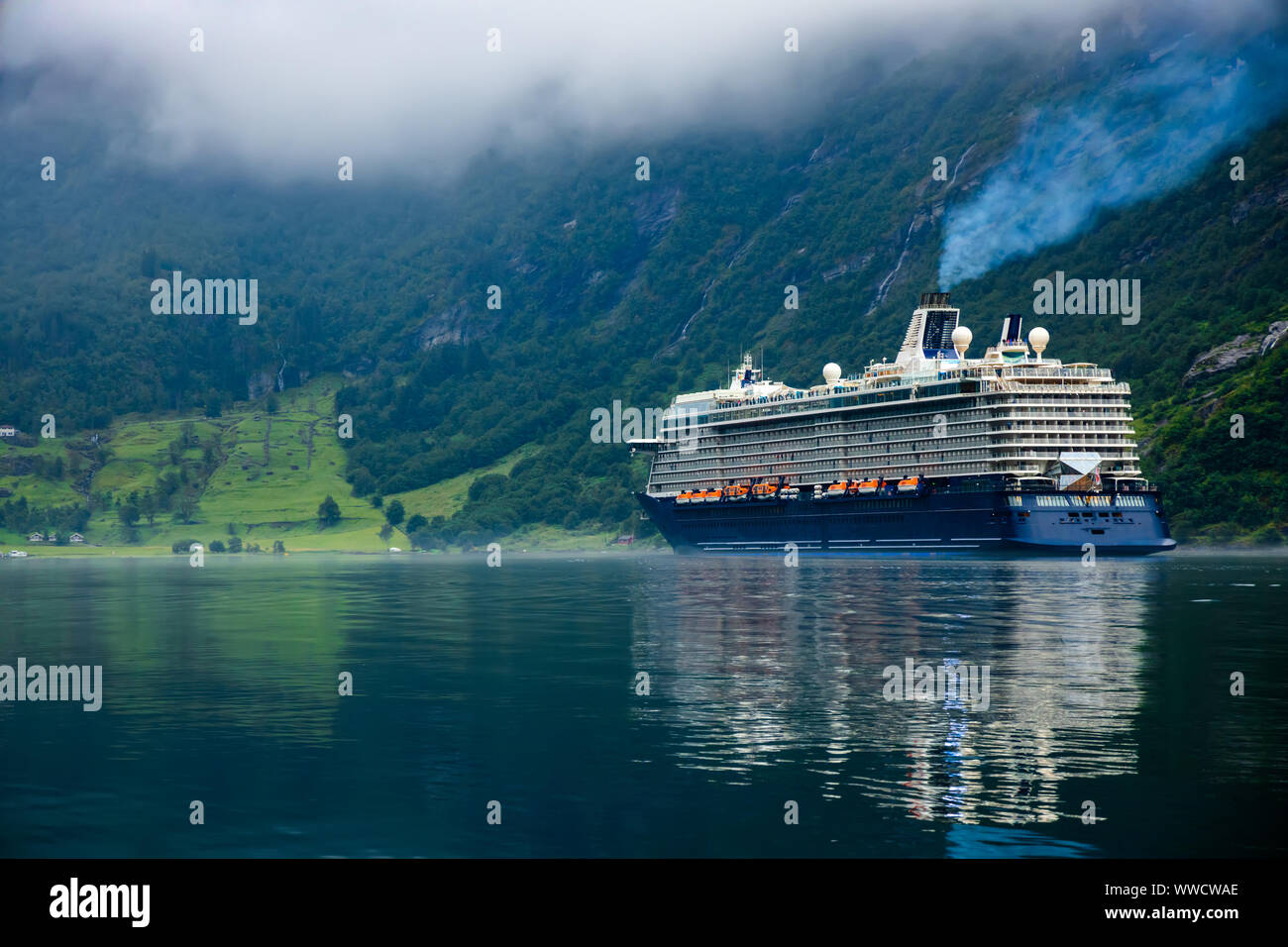 Cruise Ship, Cruise Liners On Geiranger fjord, Norway. The fjord is one of Norway's most visited tourist sites. Geiranger Fjord, a UNESCO World Herita Stock Photo