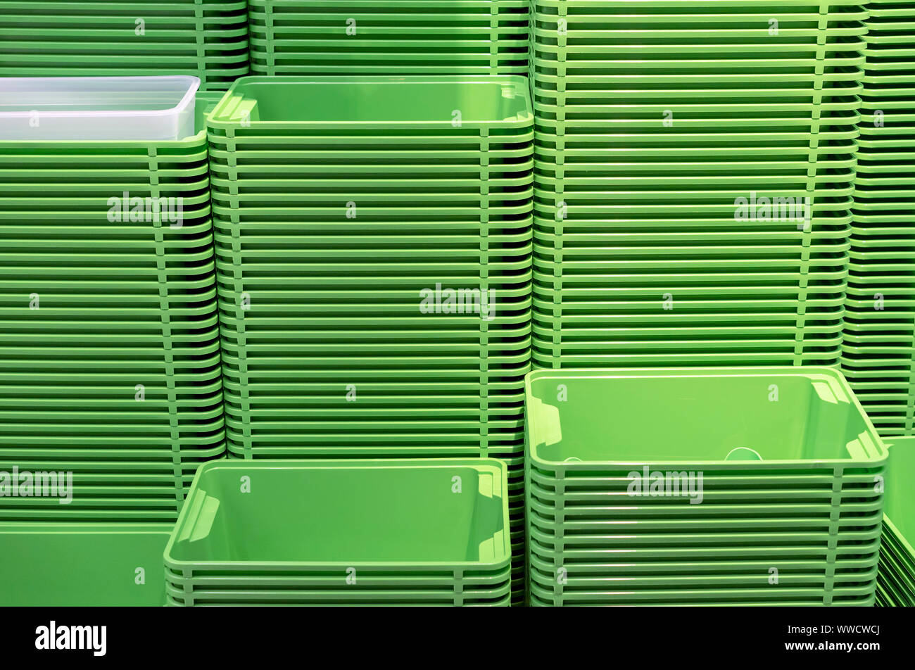 Plastic green containers stacked in several rows Stock Photo Alamy
