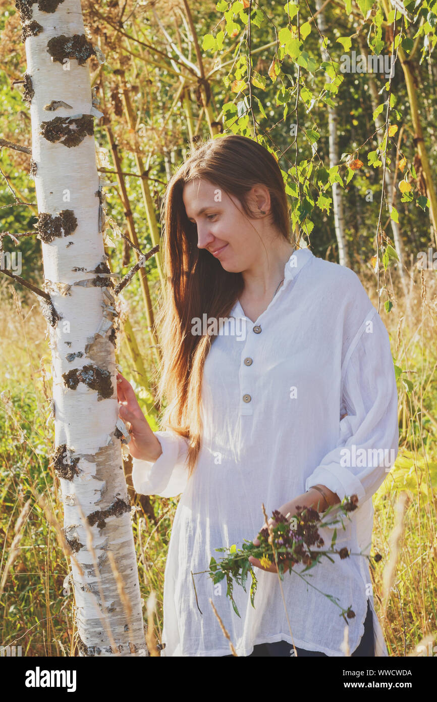 Girl near birch in the forest Stock Photo - Alamy