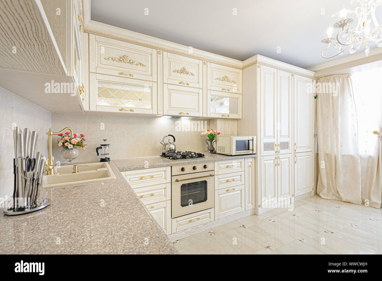Luxury Modern Beige And Cream Colored Kitchen Interior Stock Photo