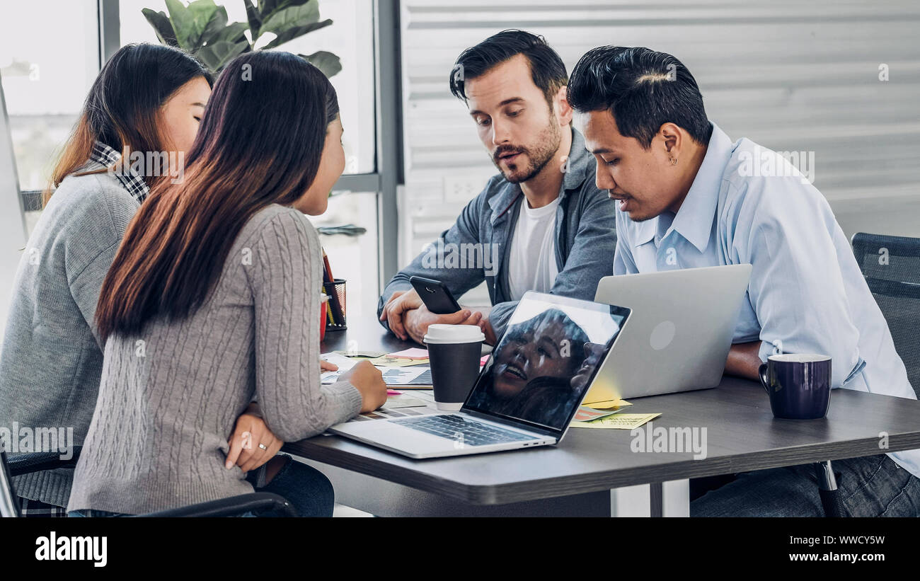 diversity creative designer team group discussion in office meeting