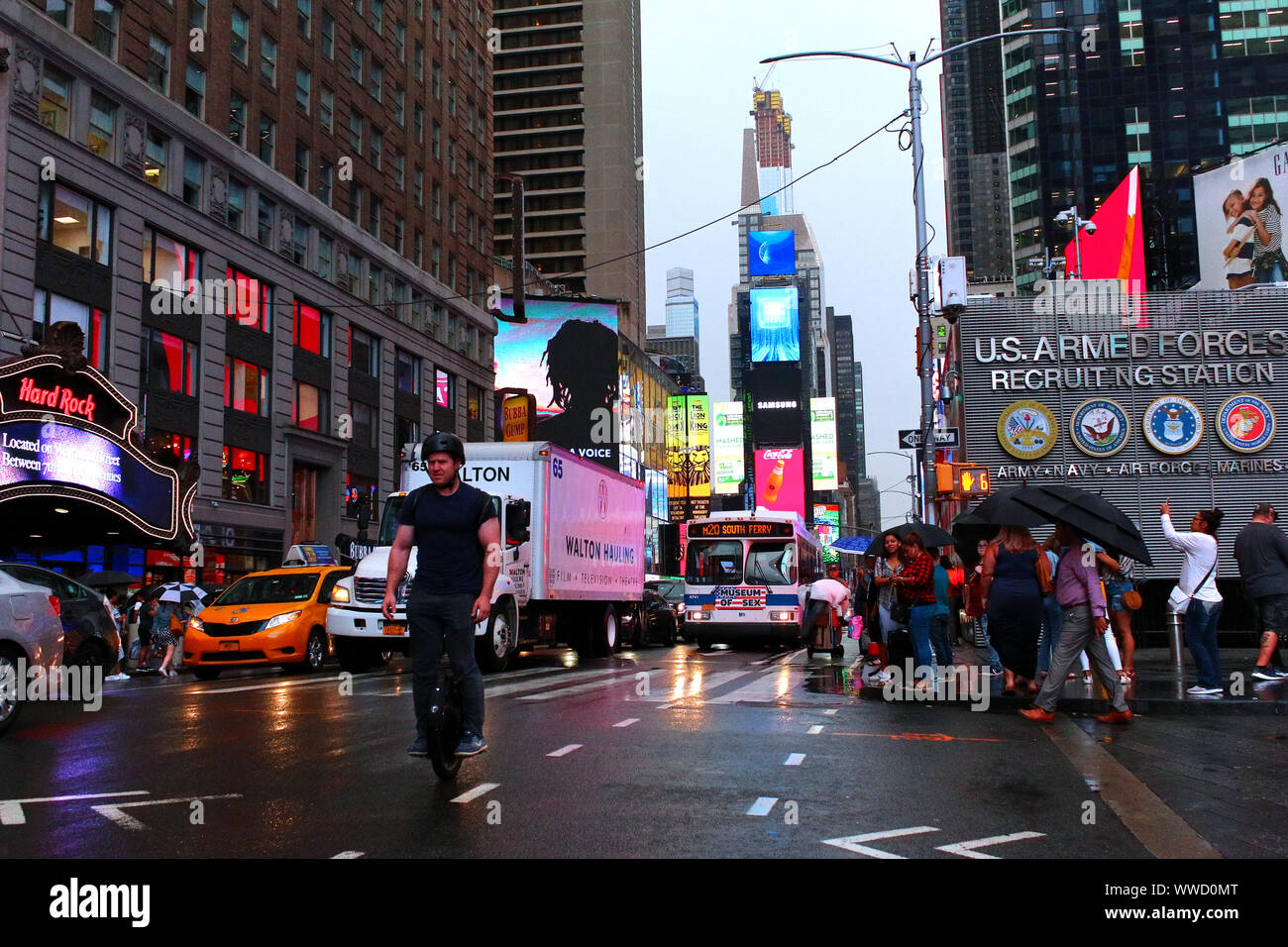 Times Square Congested Traffic of pedestrians, cyclists, and cars trudges through Times Square ...