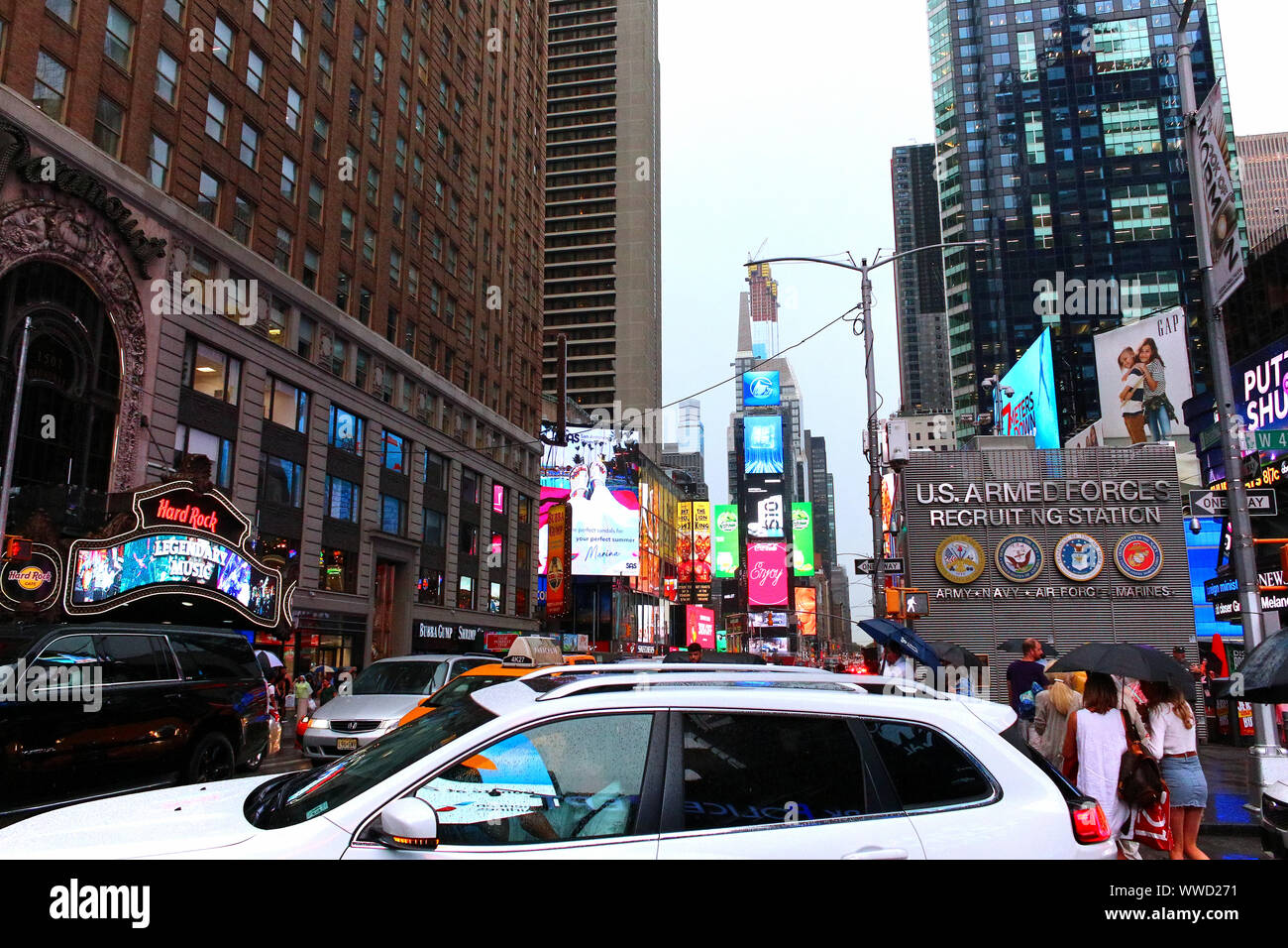Times Square Congested Traffic of pedestrians, cyclists, and cars trudges through Times Square ...