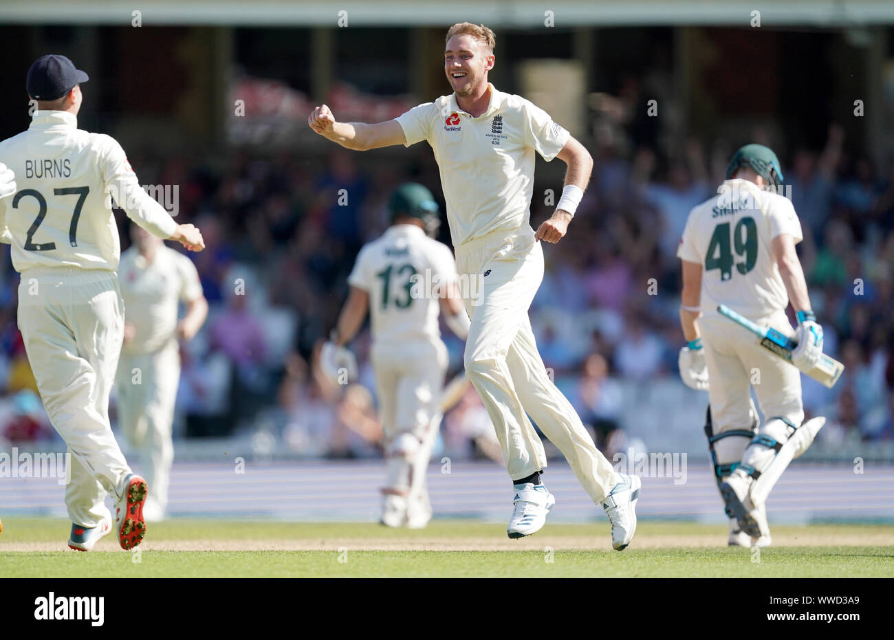 England's Stuart Broad celebrates taking the wicket of Australia's Steve Smith during day four of the fifth test match at The Kia Oval, London. Stock Photo