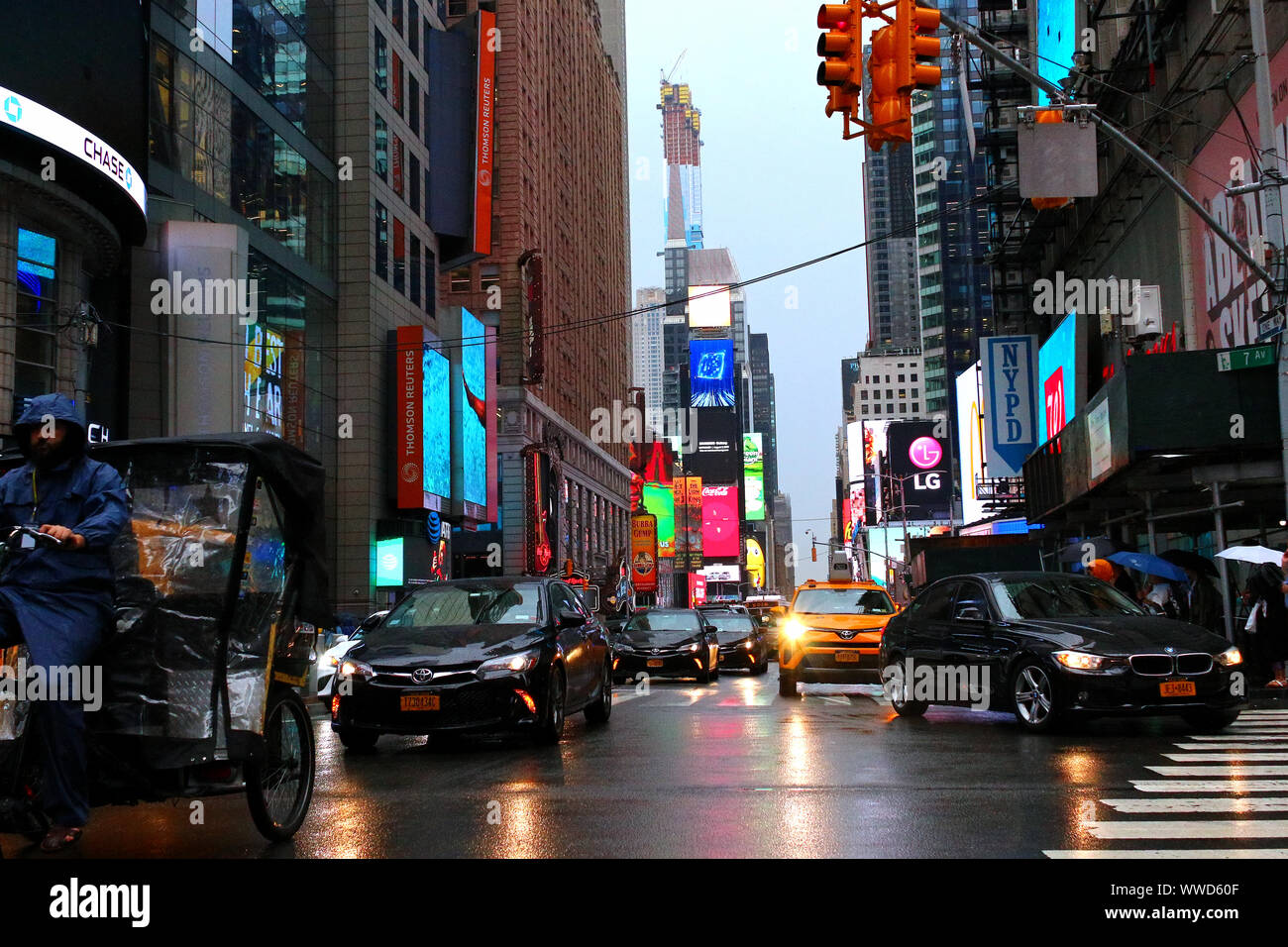 Times Square Congested Traffic of pedestrians, cyclists, and cars trudges through Times Square ...