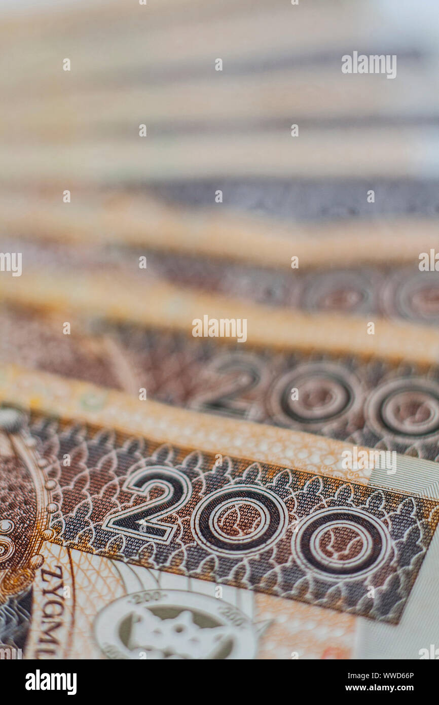 Macro closeup of number 200 on two hundred zloty polish banknotes arrenged in row Stock Photo