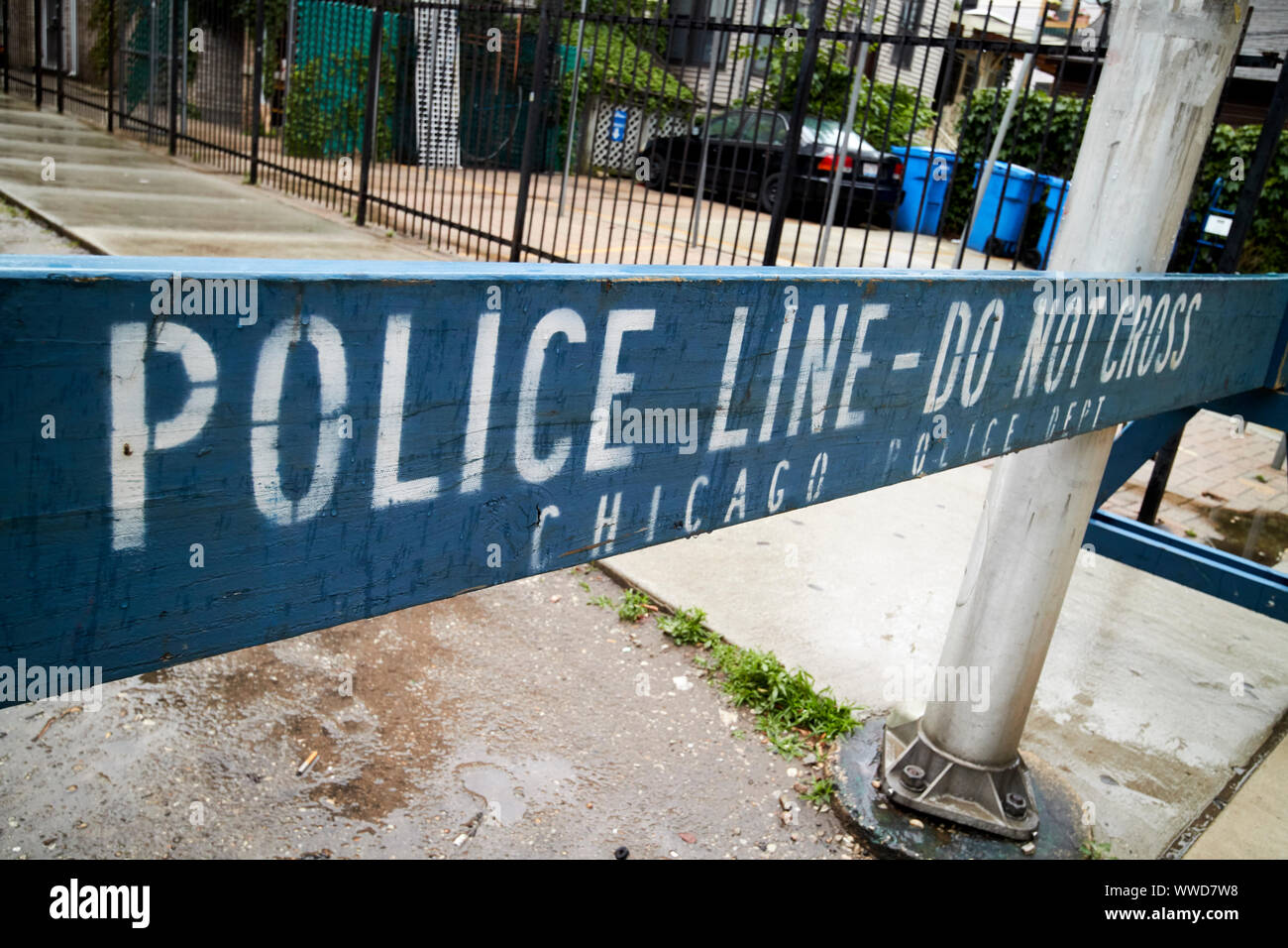 police line do not cross blue wooden safety barrier near wrigley field Chicago Illinois USA Stock Photo