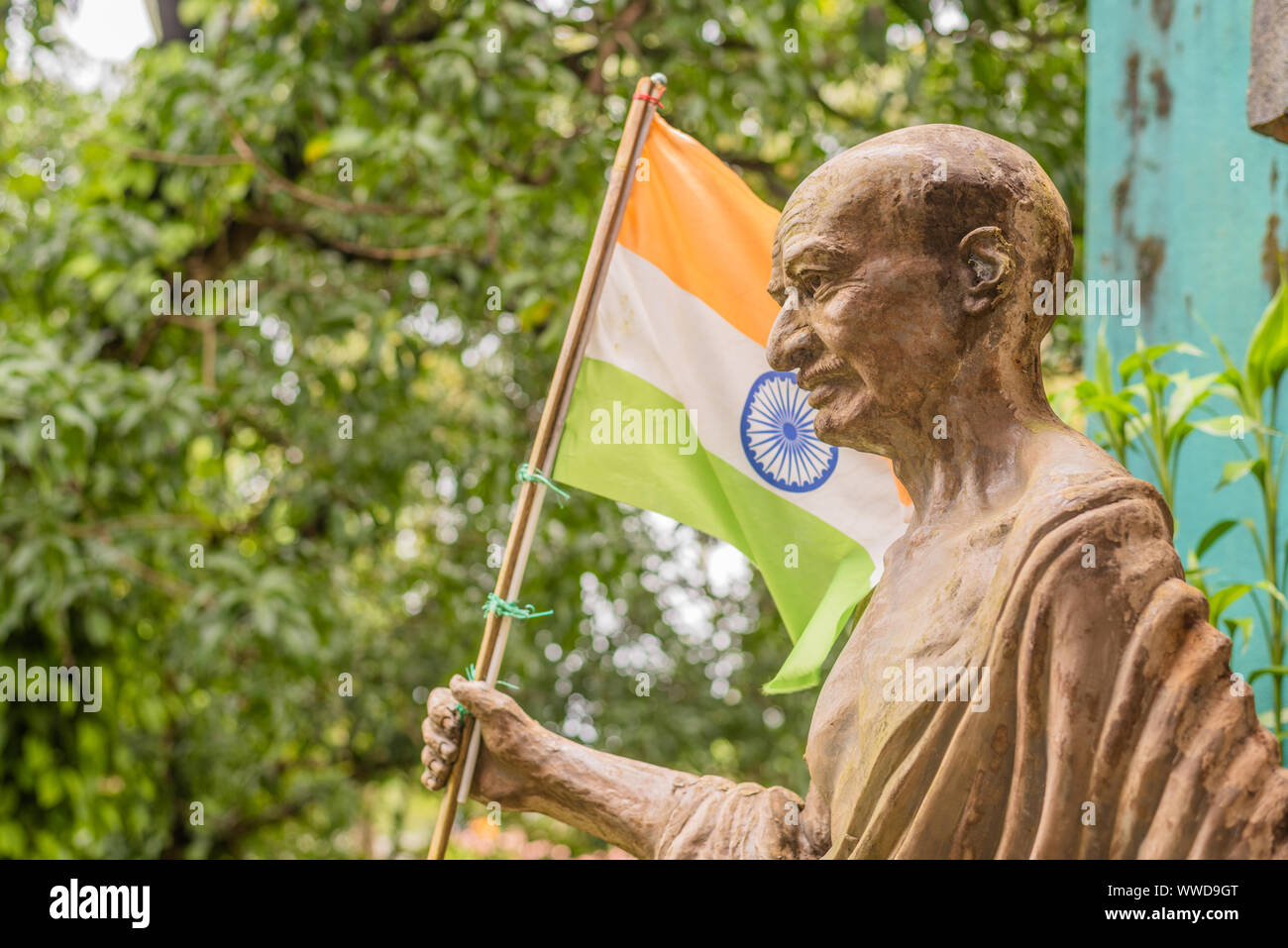 Status Of Mahatma Gandhi Holding The Indian Flag In India On The Occasion Of Independence Day Stock Photo Alamy
