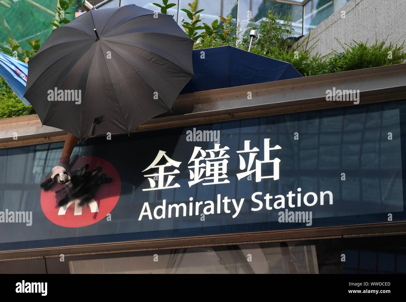 Hong Kong, China. 15th Sep, 2019. A rioter vandalizes the mass transit ...