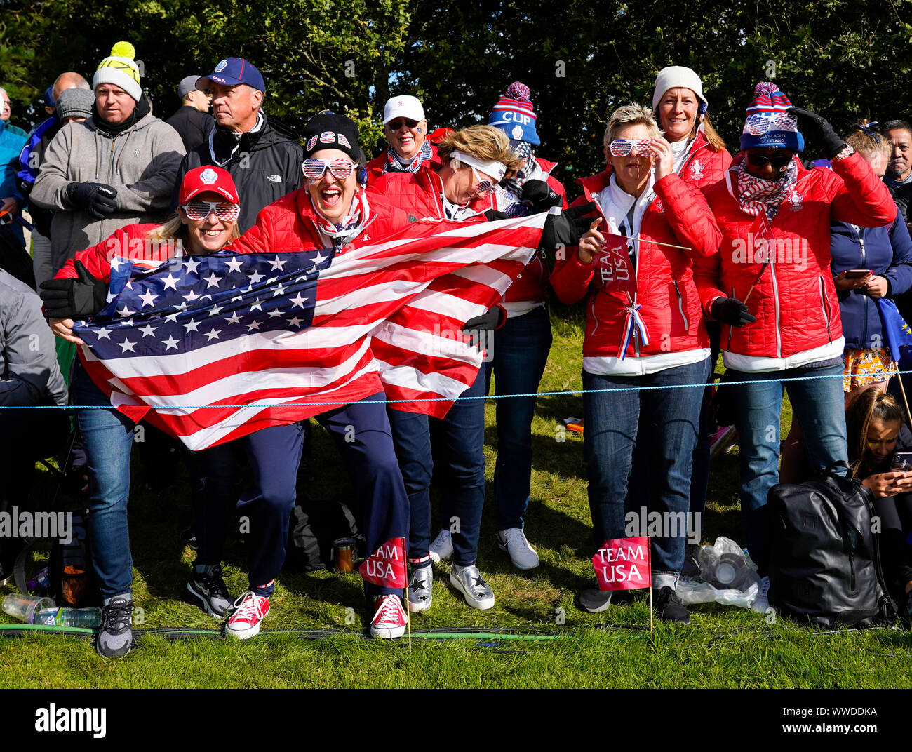Auchterarder, Scotland, UK. 15 September 2019. Sunday Singles matches on final day  at 2019 Solheim Cup on Centenary Course at Gleneagles. Pictured; Enthusiastic Team USA fans with flag beside the 10th green. Iain Masterton/Alamy Live News Stock Photo