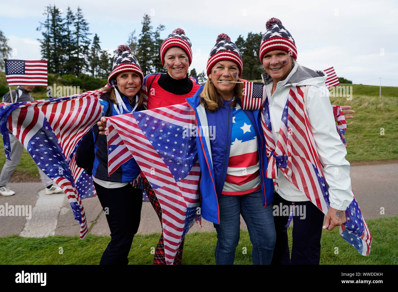 Auchterarder, Scotland, UK. 15 September 2019. Sunday Singles matches on final day  at 2019 Solheim Cup on Centenary Course at Gleneagles. Pictured; Enthusiastic Team USA fans with flag beside the 7th green. Iain Masterton/Alamy Live News Stock Photo