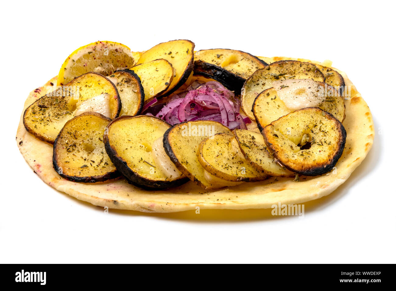 Azeri style potatoes kebab with quyruq (sheep tail fat) and red onions on lavash on a white background Stock Photo