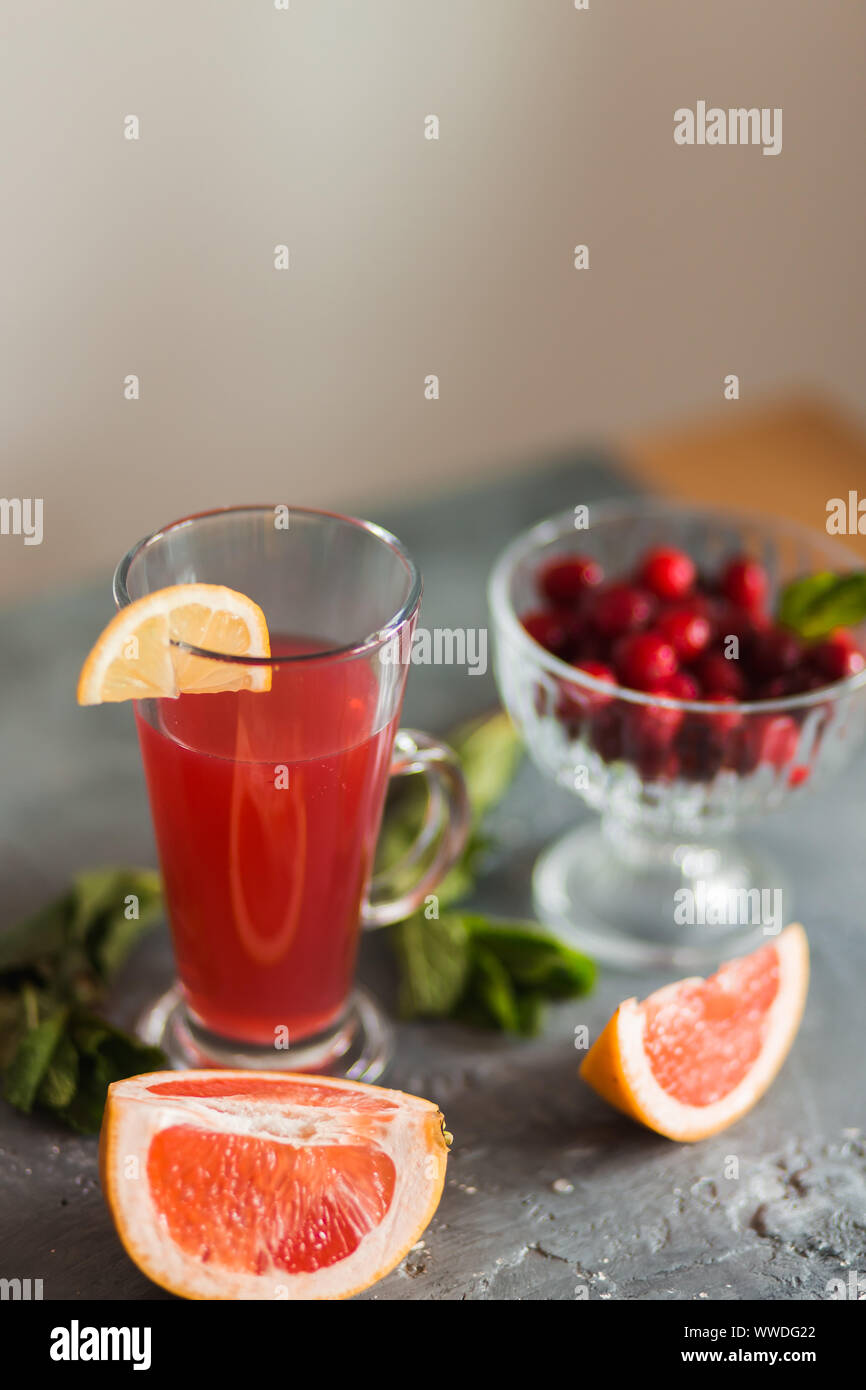 Closeup of red drink Mojito or lemonade of fruits and berries on the ...