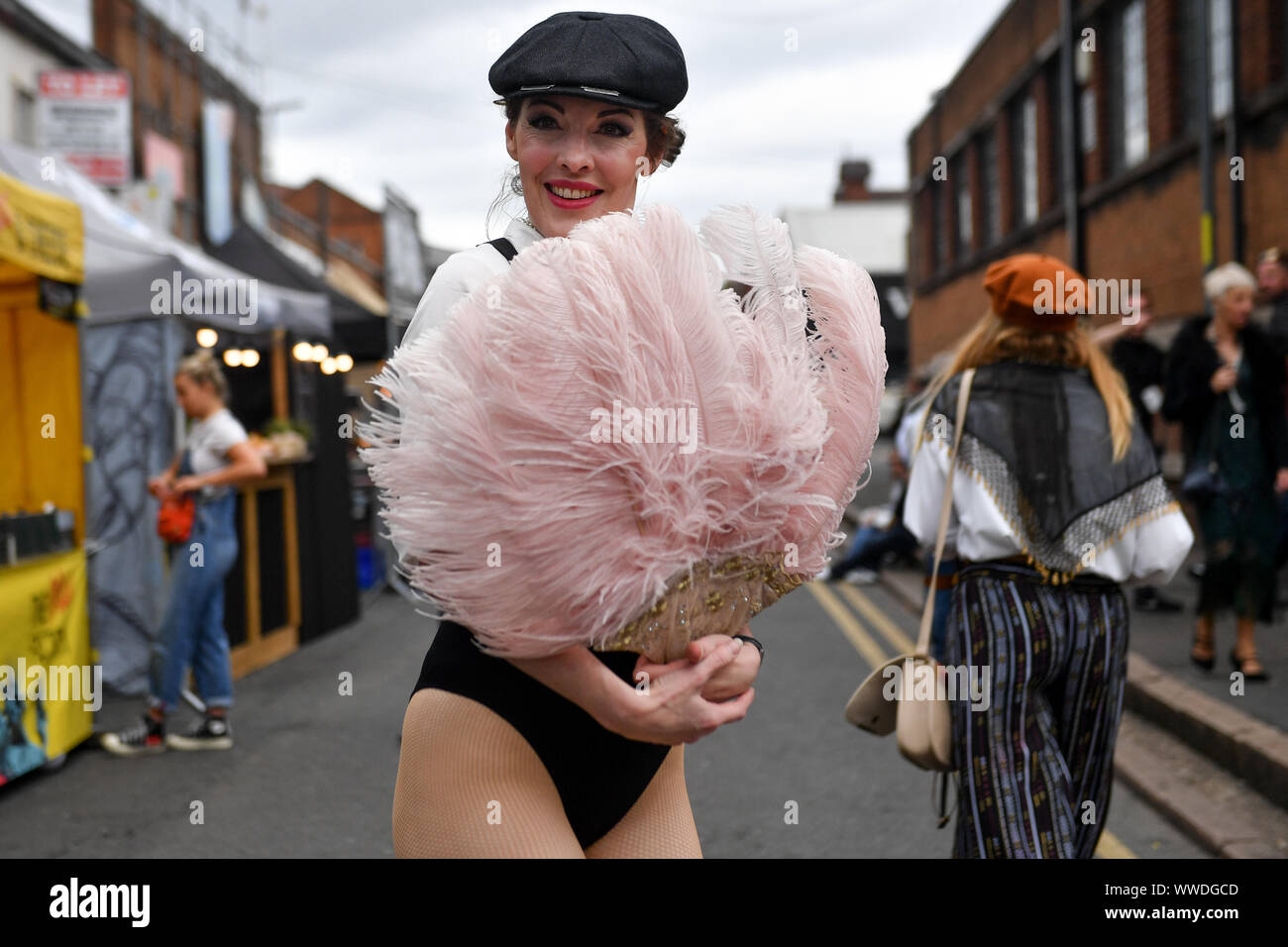 Actors recreate scenes on the streets of Digbeth during the Peaky Blinders Festival, in Birmingham. Stock Photo