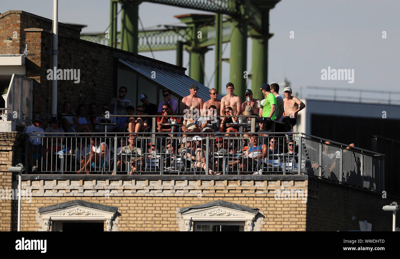 Spectators watch the match form a nearby rooftop during day four of the fifth test match at The Kia Oval, London. Stock Photo