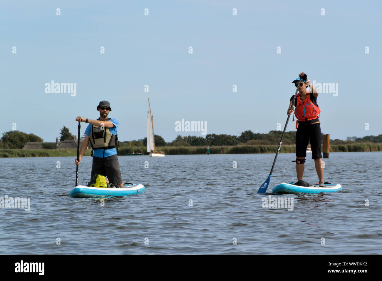 Stand up paddleboarders on Hickling Broad, Norfolk, Broads National Park Stock Photo