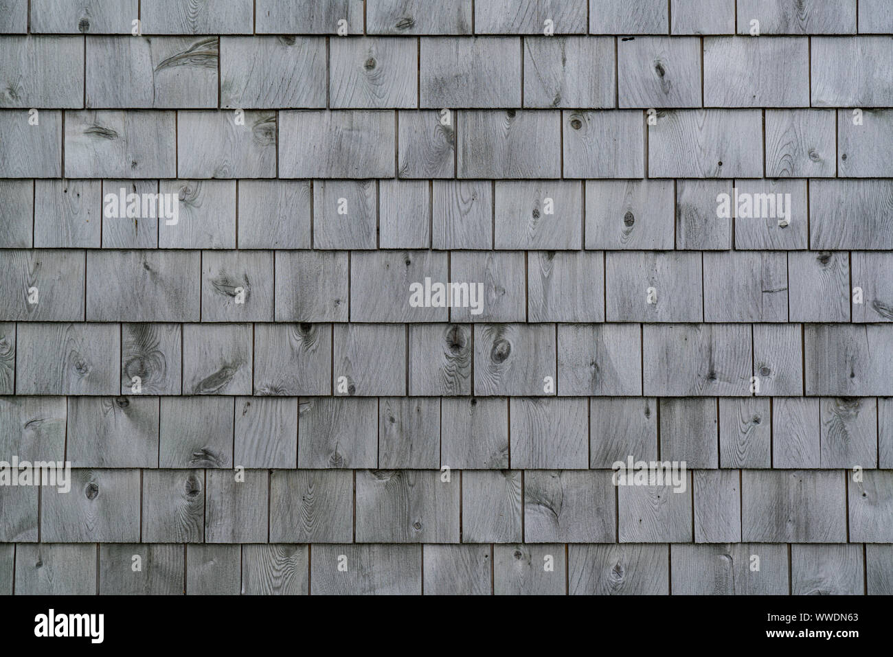 Exterior of a weathered gray cedar shingle wall Stock Photo