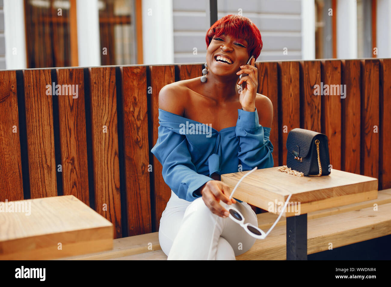 Beautiful And Stylish Dark Skinned Girl With Red Short Hair