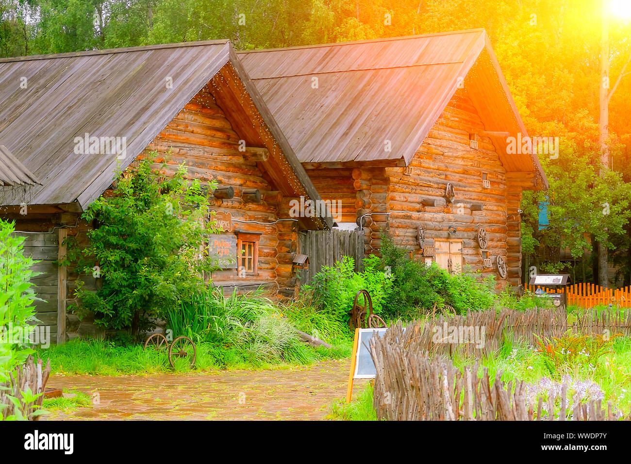 Two wooden houses on the edge of the village Stock Photo - Alamy