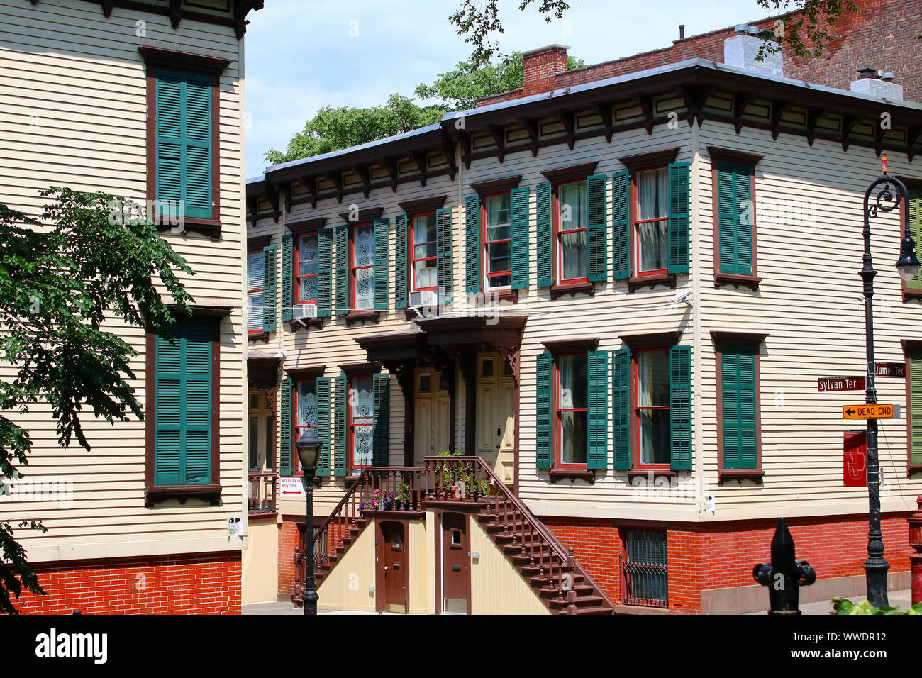 Sylvan Terrace wooden frame houses were built in 1882-1883 and are part of Jumel Terrace Historic District in Washington Heights, Manhattan on August Stock Photo